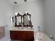 Bathroom with dual vanity, granite countertop, modern mirrors, and a soaking tub at 2515 Nw 53 Ave, Ocala, FL 34482