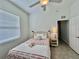 Bedroom featuring tiled floors, and a window for a bright and comfortable space at 2515 Nw 53 Ave, Ocala, FL 34482