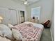 Bedroom featuring closet, dresser, and tiled floors for a stylish, comfortable space at 2515 Nw 53 Ave, Ocala, FL 34482
