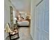 A comfortable bedroom with a large bed, dresser and side table, illuminated by natural light at 2515 Nw 53 Ave, Ocala, FL 34482