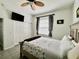 Bedroom featuring fan, closet, and dresser, showcasing modern interiors at 2515 Nw 53 Ave, Ocala, FL 34482