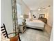 Bright bedroom features a ceiling fan, tile floors, and stylish floral curtains at 2515 Nw 53 Ave, Ocala, FL 34482