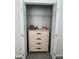 Closet space featuring open white doors with a dresser inside for added storage at 2515 Nw 53 Ave, Ocala, FL 34482