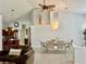 Inviting dining space with chandelier and convenient access to the kitchen at 2515 Nw 53 Ave, Ocala, FL 34482