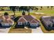 Well-maintained single-story home near a golf course, with manicured landscaping and an attached two-car garage at 2515 Nw 53 Ave, Ocala, FL 34482