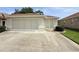 Exterior shot showcasing the garage with a screen and a well-maintained lawn with a sidewalk at 2515 Nw 53 Ave, Ocala, FL 34482
