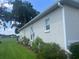 Home exterior featuring a well-kept lawn, landscaping, and access to community amenities like a golf course at 2515 Nw 53 Ave, Ocala, FL 34482