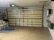 Spacious garage featuring overhead storage and plenty of room for multiple vehicles at 2515 Nw 53 Ave, Ocala, FL 34482
