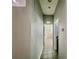 Hallway with tiled floors leading to rooms with updated fixtures and modern finishes at 2515 Nw 53 Ave, Ocala, FL 34482