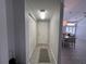Hallway featuring a storage closet and easy access to other parts of the home at 2515 Nw 53 Ave, Ocala, FL 34482