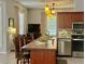 The kitchen island offers extra counter space and a view into the living room at 2515 Nw 53 Ave, Ocala, FL 34482