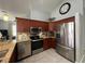 A modern kitchen features stainless steel appliances and granite countertops at 2515 Nw 53 Ave, Ocala, FL 34482
