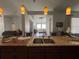 View of the kitchen island with a stainless sink overlooking the open-concept living spaces at 2515 Nw 53 Ave, Ocala, FL 34482