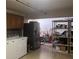 Laundry room featuring a stainless steel refrigerator, washer, and dryer at 2515 Nw 53 Ave, Ocala, FL 34482