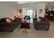 Inviting living room features cozy seating and a decorative rug over tile flooring at 2515 Nw 53 Ave, Ocala, FL 34482