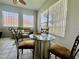 Cozy living room with tile floors, a table, comfortable seating, and windows offering lots of natural light at 2515 Nw 53 Ave, Ocala, FL 34482