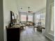 A bright, airy living room has a breakfast nook and lots of sunlight at 2515 Nw 53 Ave, Ocala, FL 34482