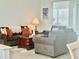 Cozy living room with comfortable seating, adjacent to dining room and open floorplan at 2515 Nw 53 Ave, Ocala, FL 34482