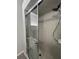 Enclosed shower featuring tiled walls, sliding glass doors, and updated fixtures at 2515 Nw 53 Ave, Ocala, FL 34482