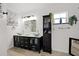 Modern bathroom with a double sink vanity, stylish fixtures, and ample storage at 32 Dogwood Drive Loop, Ocala, FL 34472