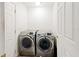 Convenient laundry room featuring a modern, front-loading washer and dryer set at 32 Dogwood Drive Loop, Ocala, FL 34472