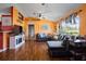Bright, open living room with hardwood floors, a comfortable sectional, and large windows at 32 Dogwood Drive Loop, Ocala, FL 34472