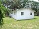 Rear exterior view shows well-maintained lawn and ample space for outdoor activities at 3418 Se 94Th St, Ocala, FL 34480