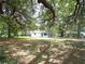 Cozy single-story home nestled among mature trees on a spacious lot, offering a peaceful and private retreat at 3418 Se 94Th St, Ocala, FL 34480