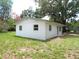 Cozy single-story home with fresh exterior paint and a serene backyard setting surrounded by greenery at 3418 Se 94Th St, Ocala, FL 34480