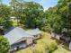 Aerial view of a home with an expansive backyard and mature tree coverage at 3621 Se 12Th Pl, Ocala, FL 34471