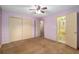 Bedroom with large closets and an adjacent bathroom at 3621 Se 12Th Pl, Ocala, FL 34471