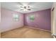 Bedroom with ceiling fan, carpet, and two windows at 3621 Se 12Th Pl, Ocala, FL 34471