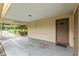 This is a view from the carport looking out to the front yard and quiet street at 3621 Se 12Th Pl, Ocala, FL 34471
