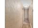 Hallway with neutral carpeting and textured walls at 3621 Se 12Th Pl, Ocala, FL 34471