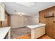 The kitchen boasts modern appliances, a breakfast bar, wood-paneled walls and access to the living area at 3621 Se 12Th Pl, Ocala, FL 34471