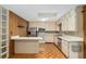 This kitchen is equipped with stainless steel appliances, a skylight, and a breakfast bar at 3621 Se 12Th Pl, Ocala, FL 34471