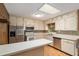 This kitchen showcases stainless steel appliances and ample counter space with natural light from a window at 3621 Se 12Th Pl, Ocala, FL 34471