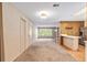 The kitchen is adjacent to a living area and features stainless steel appliances and a breakfast bar at 3621 Se 12Th Pl, Ocala, FL 34471