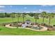 Backyard gazebo with a pond, bridge, and fountain offering a peaceful retreat at 4550 County Road 104, Oxford, FL 34484