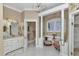 Elegant bathroom featuring a marble vanity, and shower with glass enclosure at 4550 County Road 104, Oxford, FL 34484