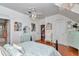This charming bedroom has a soft color palette, chandelier and plenty of storage at 4550 County Road 104, Oxford, FL 34484