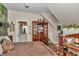 View of bedroom with ensuite bathroom, wooden furniture and decor, and wood floors at 4550 County Road 104, Oxford, FL 34484
