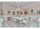 Formal dining room with chandelier, wainscoting, and a beautiful area rug at 4550 County Road 104, Oxford, FL 34484