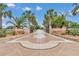 Long driveway with decorative brick walls, iron gates, and elegant concrete work at 4550 County Road 104, Oxford, FL 34484