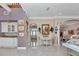 Open foyer with high ceilings and views into the kitchen and living room at 4550 County Road 104, Oxford, FL 34484
