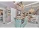 Kitchen island with oven, adjacent to dining and living areas at 4550 County Road 104, Oxford, FL 34484