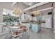 Elegant eat-in kitchen featuring granite countertops and stainless steel appliances at 4550 County Road 104, Oxford, FL 34484