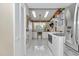 Spacious laundry room featuring ample storage, modern appliances, and a stylish chandelier at 4550 County Road 104, Oxford, FL 34484