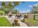 Outdoor seating area with umbrellas and views of the landscape, perfect for relaxing at 4550 County Road 104, Oxford, FL 34484