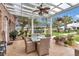 Charming outdoor patio with comfortable seating and dining, perfect for entertaining at 4550 County Road 104, Oxford, FL 34484